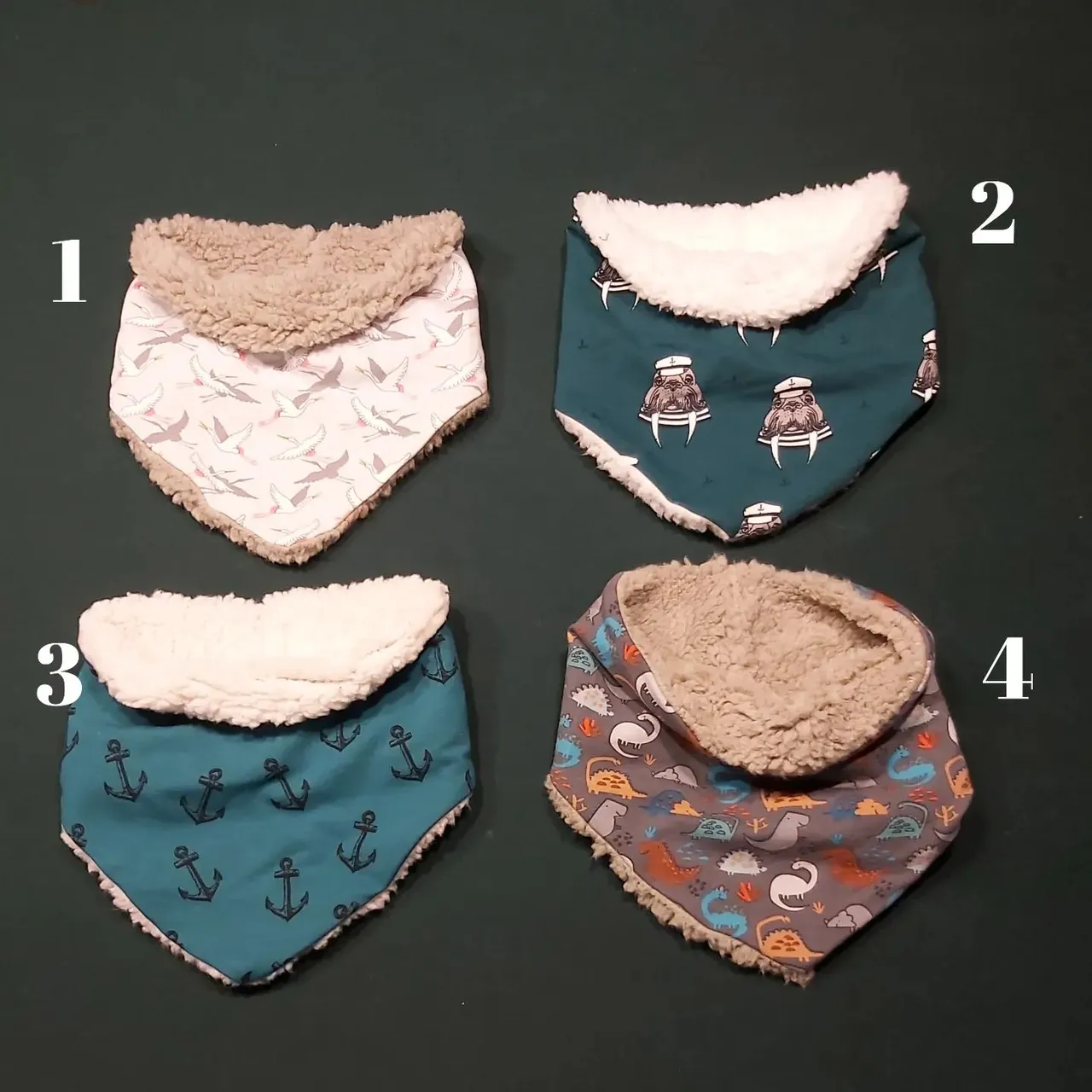 Looking for a last minute gift? We have a number of our super snuggly bandana snoods made up and ready to collect or post. Small suitable upto 5 years £12 medium 6 years to small teen £12, large for teen to adult £14. We can post with 24hour tracked for £2.
1. Small cranes
2. Small walrus
3. Small anchors
4. Small dinos
5. Small pinecone
6. Small fern
7. Small swallows
8. Small foxes-SOLD
9. Medium dogs
10. Medium cranes
11. Medium fern
12. Medium walrus
13. Large fern
14. Large pinecone
15. Large anchors
16. Large swallows
#lastminutegift #lastminute.com #xmasgift #snood #babyhood #toddlersnood #kids snood #bandanasnood #fleecesnood #sherpafleece