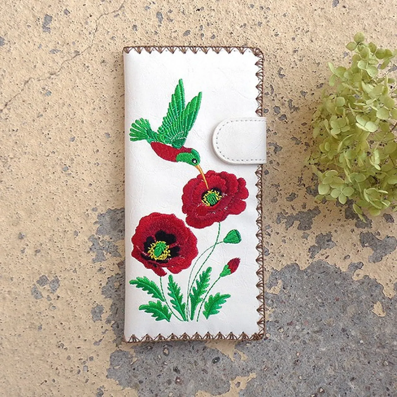 From Elma collection for #holiday season 2022 designed by #vegan brand @LAVISHY, this large flat wallet features delightful #hummingbird & #poppy #flower #embroidery motif with #bohemian vibe inspired by a #Ukrainian painting. Made with Eco-friendly vegan materials that are toxic-free, recyclable and biodegradable. It's great for everyday use, also makes a charming #gift idea for family & friends especially for those who celebrate #Ukraine & Ukrainian culture or just love #bird & #flower.