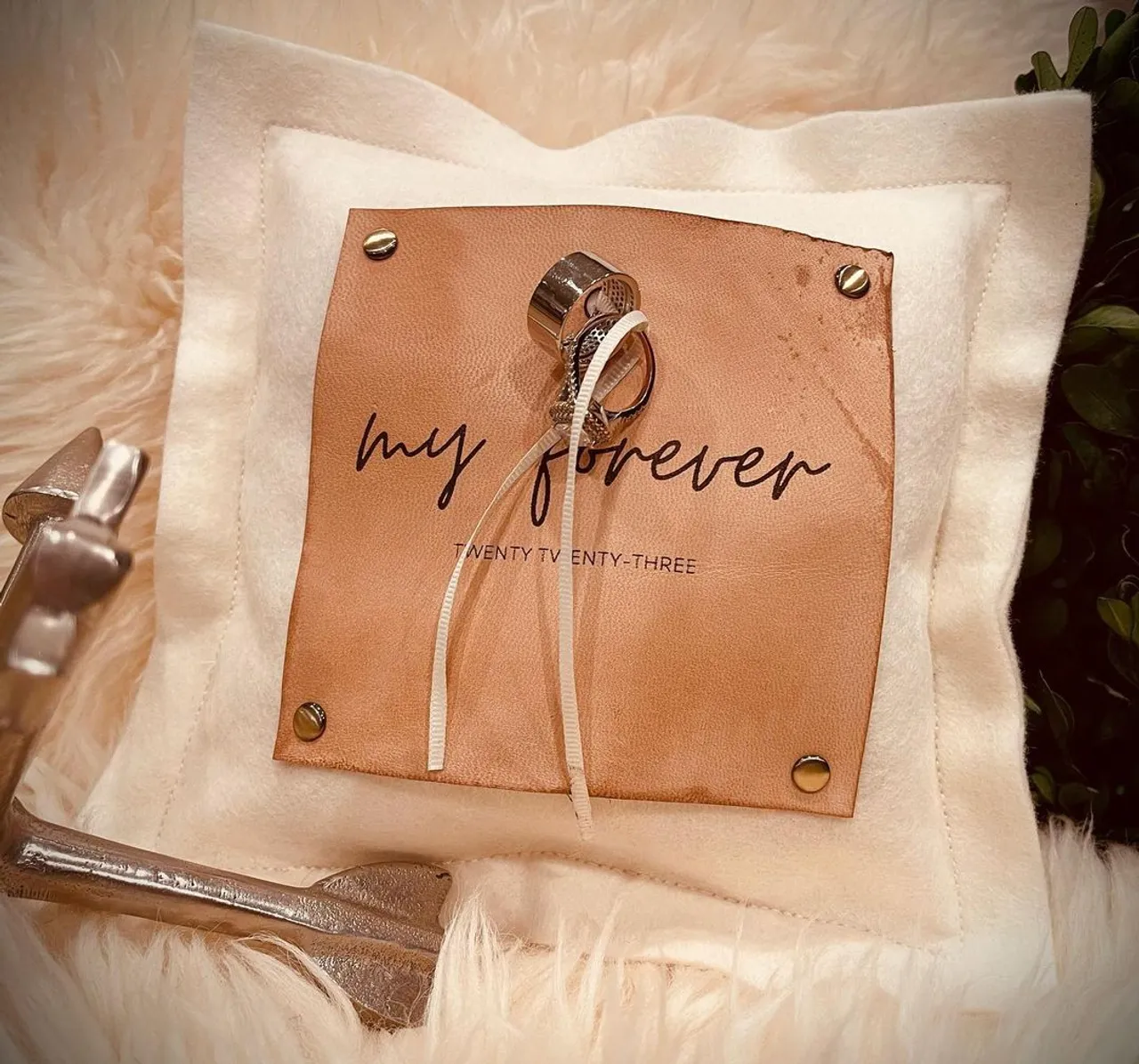 Wedding season is near and SUEDEKLOTH has new items just in time! This customizable ring bearer pillow will adorn your rings for your special day. Our 9" square ring pillow is made of 100% American felted wool and features a riveted, 5" engraved American veg tan natural oiled leather patch on the front that doubles as a lovely place to hold your vows. This pillow comes complete with a veg tan natural leather strap on the back so little hands can easily carry your rings down the aisle. Tie your rings with your choice of grosgrain ribbon or suede ribbon. After your big day you've got a beautiful keepsake to display with wedding photos and other treasured family decor. Each ring pillow we offer is 100% customizable with your specific details. We can create any design you'd like.
#wedding #weddingdress #weddingphotography #weddinginspiration #weddingguest #custom #leather #engrave #gift #bride #bridal #springwedding #ringpillow #groomsman #groomsmen #bouquet #bridesmaid #vow #flowergirl