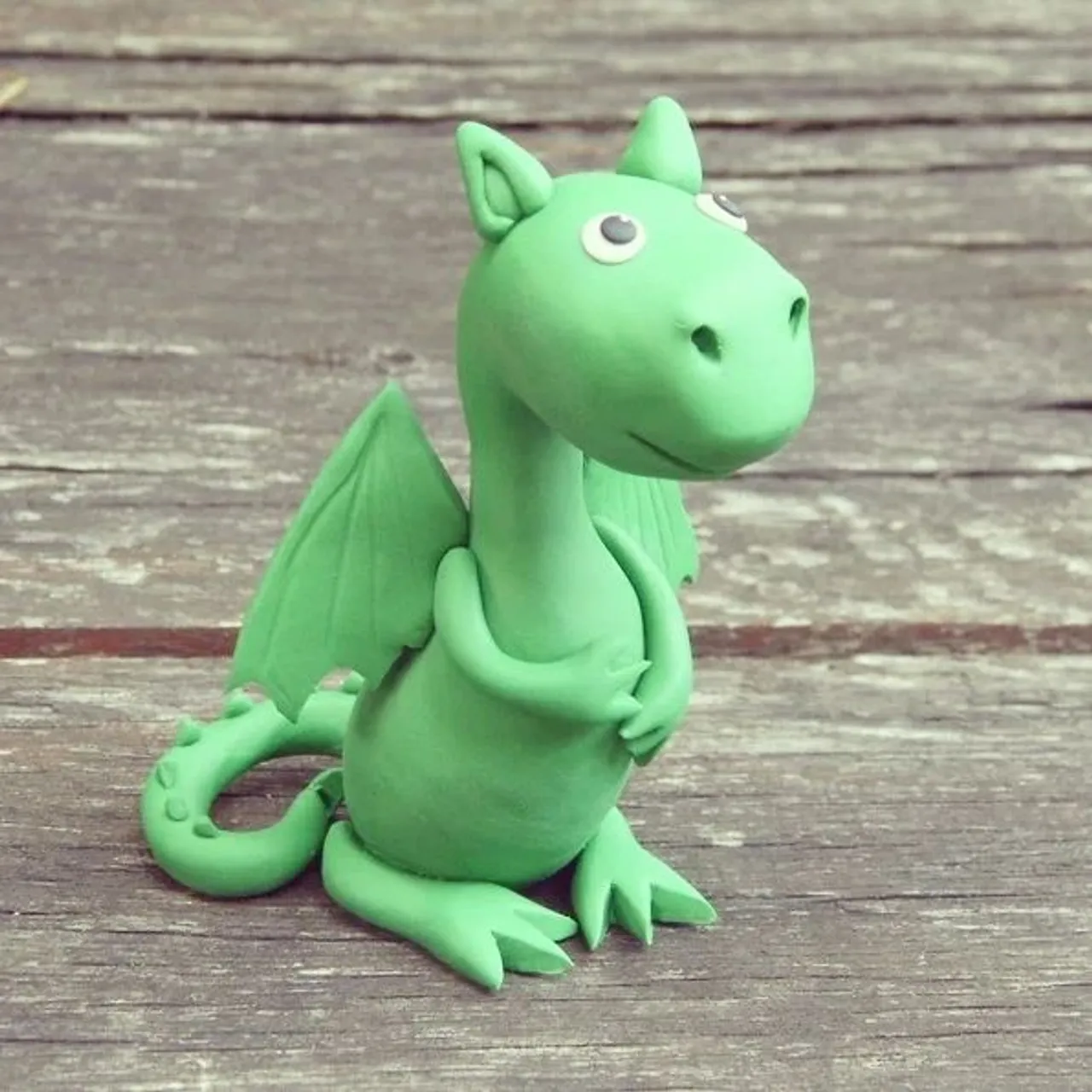 The dragon in children's style - symbol of Ljubljana 😊 #dragon #ljubljanadragon #dragonfigurine #dragonsculpture #polymerclay #creatingmemories❤️ #gifts🎁 #personalizedgift #greendragon #birthday #memoryoftheday #vacationmemories #citymemories #ljubljanasouvenirs #souvenirs #souveniershop #sightsofthecity #dragonparty #uniquegiftideas #beautifulmemories❤️