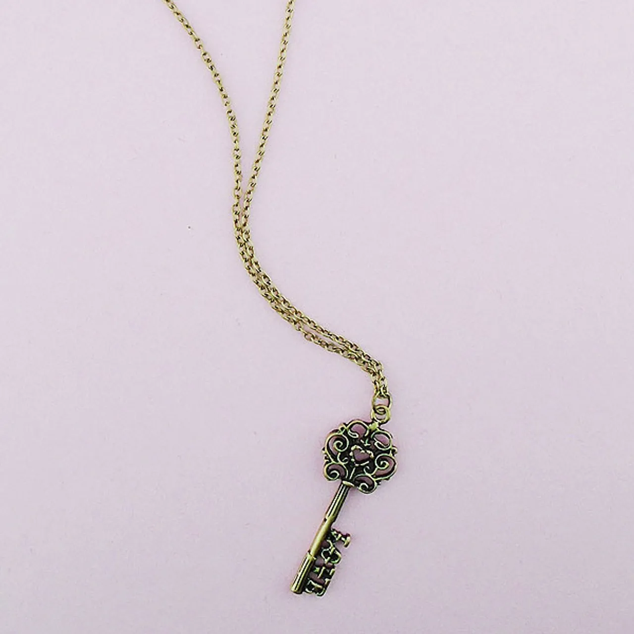 LAVISHY 883-102 vintage style key of love necklace: From Flare collection by LAVISHY, this handmade vintage style key of love pendant necklaces were original designs of LAVISHY. We are quit proud of this design where you place a heart shape in the middle of the top part the key and LOVE at the end of the key. They make great gifts for your loved one.
Base metal: Zinc alloy
Plating: Imitation silver, gold, brass, antique silver & antique gold
Safety: Nickel & lead free, non-allergenic / hypo-allergenic
Measurement:
 -Pendant:  inch /  cm
 -Chain: 18 inch with 2 inch extension chain LAVISHY logo tag
Wholesale available at www.lavishy.com with other unique & fun fashion jewelry for gift shop & boutique buyers. We ship worldwide since 2001.