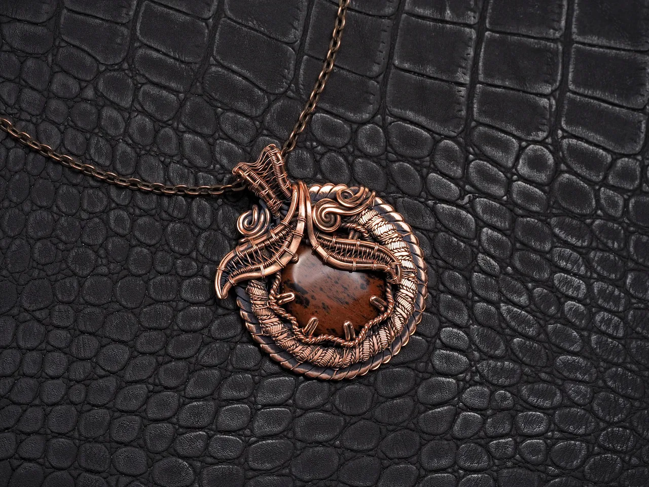 This unique was pendant handcrafted by weaving pure copper wire and natural red obsidian. Copper was artificially aged to create an antique look and to highlight the details of the wire work. Polished to a shine and varnished to prevent darkening.
Each piece is handcrafted by me from start to finish. Each piece is designed by me and is always unique. Each work in a single copy. Completely handmade!
This pendant can be a wonderful addition to your image, as well as a memorable gift!
You will get exactly the jewelry that you see in the photo.
Each piece is one of a kind and crafted with love!

Item details:
Height -5.8 cm
Width - 4.7 cm

If you have questions - just ask.
I wish you a happy shopping time and a good mood!