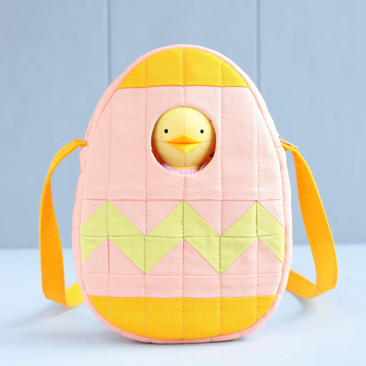 Fresh from the sewing machine! Another small quilted bag — an Easter egg for carrying the Easter chick. I really love to add windows to my bags and pouches. It literally takes just a couple of minutes, but makes the bag so much more fun! The sewing pattern is already available in my store!