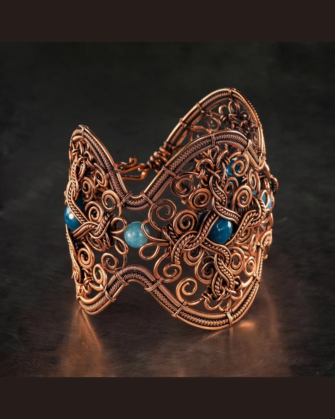 Very wide copper wire wrapped bracelet with blue Agate for woman , Statement jewelry, 7th Anniversary gift for her woman, Unique copper jewelry, Braided Art Nouveau antique style bracelet, Oxidized pure copper, Handmade
❂ The bracelet is made of pure copper wire and blue agate . The copper is artificially aged with patination, which gives an antique look and makes the details of the bracelet more expressive. After patination, the bracelet was polished to a shine, which gives a beautiful aesthetic appearance to the bracelet. The bracelet is covered with a protective varnish to prevent darkening.
You will receive the exact bracelet you see in the photos.
The bracelet can be combined with any wardrobe and emphasize your uniqueness and style.
❂ Bracelet details:
◀◀ READ IT PLEASE ▶▶ I offer several options for the length of the bracelet. To correctly choose the size of the bracelet, you need to add 1.5 cm (0.6") to the size of your wrist girth. You will get the length of the bracelet that suits you. Choose the desired length of the bracelet from the suggested options.
Bracelet Width:6.8 cm