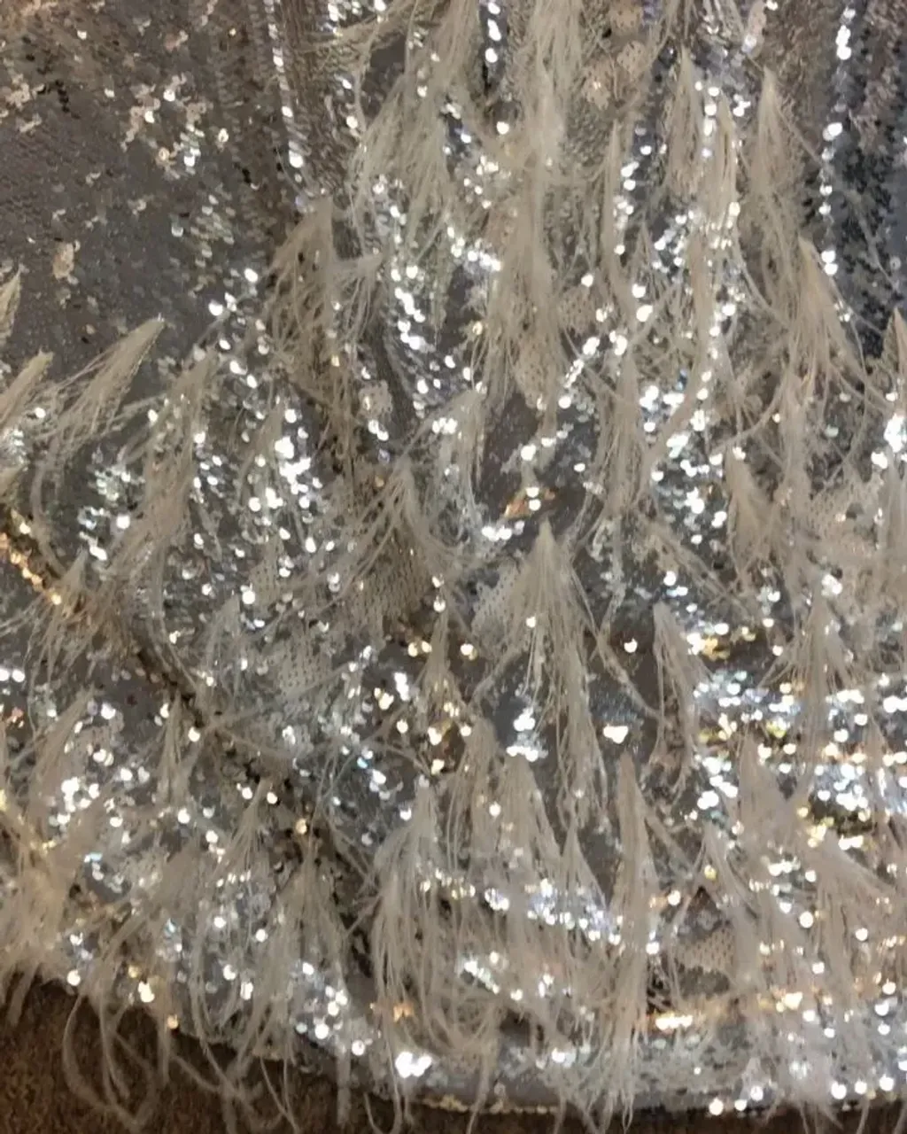 And here is a silver-white sequin wedding dress! Our Bride asked us to decorate her with feathers, so the dress also has real ostrich feathers! You can see everything in the movie! 🥰😍
---
We sew handmade wedding dresses from scratch! Choose a ready-made wedding dress design, make changes or create your own unique wedding dress. We make on-line orders!
---
#sequinsweddingdress #sequinweddingdress #sequinsbridalgown #sequinbridalgown #whiteweddingdress #whitebridalgown #silverweddingdress #silverbridalgown #feathersweddingdress #feathersbridalgown #weddingdress #weddingdresses #weddinggown #dreamwedding #weddingday #instawedding #bridaltrends #bridalgowns #bridalstylist #customweddingdress