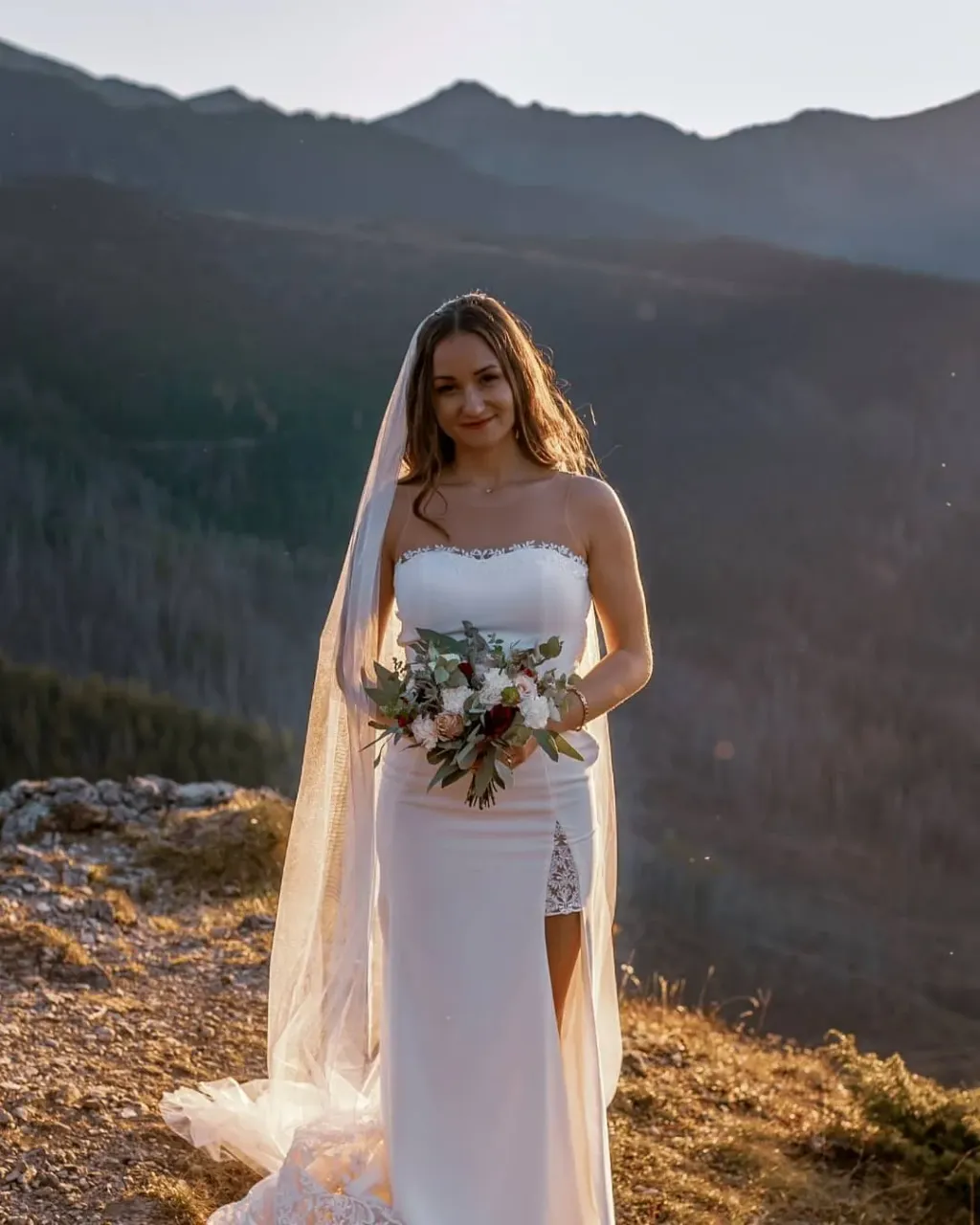 We present you our Bride - this is Anna! 😍 We sew that wedding dress based on one of our delightful designs - Palmyra (https://www.etsy.com/listing/776552521/). • You can't hide that this lace train is simply delightful, the front is a completely different story! Anna decided to add a slit for leg, change the neckline to the shape of the heart and add lace elements at the neckline and in the leg slit! • For the dress we made a classic long veil from delicate Italian tulle. 
Thank you very much for sending photos in a beautiful Scottish climate! 🥰
---
Handmade wedding and evening dresses. Buy ready dress or make online custom order on our Etsy shop
👉 Link in bio
https://www.etsy.com/shop/AtelierLuckyDress
---
#realbride #luckydressatelierbride #weddingday #husbandandwife #brideandgroom #weddingcouple #brides #bridestory #bridetobe #bridedress #weddingdressideas #weddinggowns #weddingdays #brideinspiration #brideoftheday #handmadeweddingdresses #weddingdresshandmade #bridaldressmaker #sexyweddingdress #sexybride #mermaidweddingdress #scottishwedding #scottishbride #scottishwievs #scottishgroom #weddingphotosesion