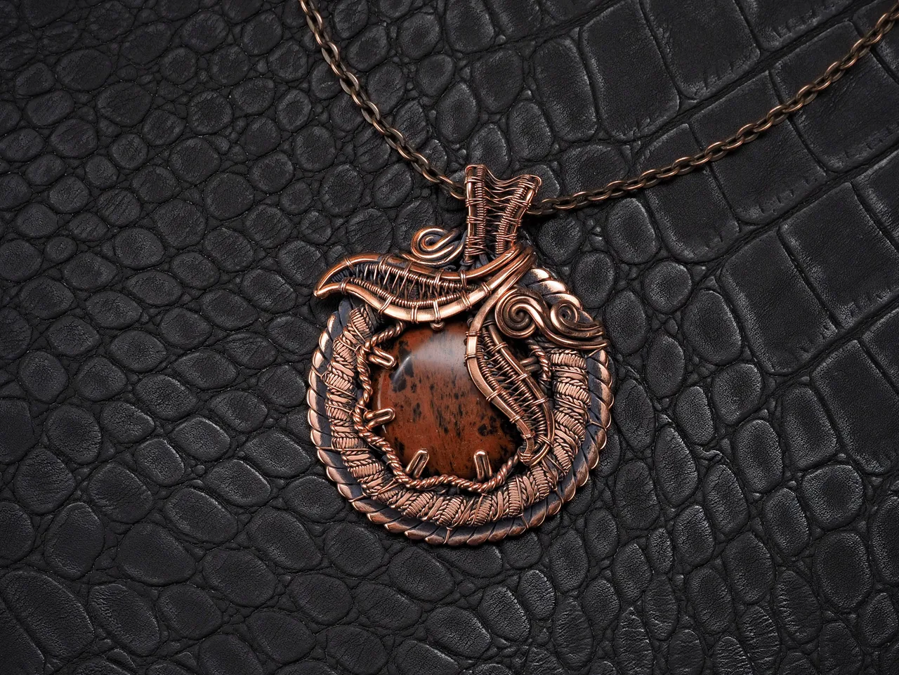 This unique was pendant handcrafted by weaving pure copper wire and natural red obsidian. Copper was artificially aged to create an antique look and to highlight the details of the wire work. Polished to a shine and varnished to prevent darkening.
Each piece is handcrafted by me from start to finish. Each piece is designed by me and is always unique. Each work in a single copy. Completely handmade!
This pendant can be a wonderful addition to your image, as well as a memorable gift!
You will get exactly the jewelry that you see in the photo.
Each piece is one of a kind and crafted with love!

Item details:
Height -5.8 cm
Width - 4.7 cm

If you have questions - just ask.
I wish you a happy shopping time and a good mood!