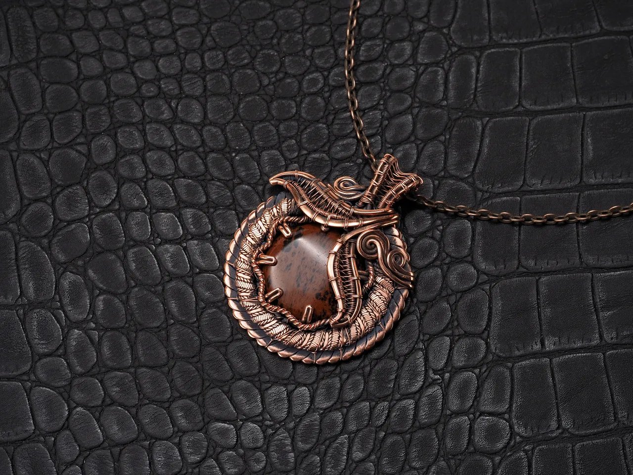 This unique was pendant handcrafted by weaving pure copper wire and natural red obsidian. Copper was artificially aged to create an antique look and to highlight the details of the wire work. Polished to a shine and varnished to prevent darkening.
Each piece is handcrafted by me from start to finish. Each piece is designed by me and is always unique. Each work in a single copy. Completely handmade!
This pendant can be a wonderful addition to your image, as well as a memorable gift!
You will get exactly the jewelry that you see in the photo.
Each piece is one of a kind and crafted with love!

Item details:
Height -5.8 cm
Width - 4.7 cm

If you have questions - just ask.
I wish you a happy shopping time and a good mood!