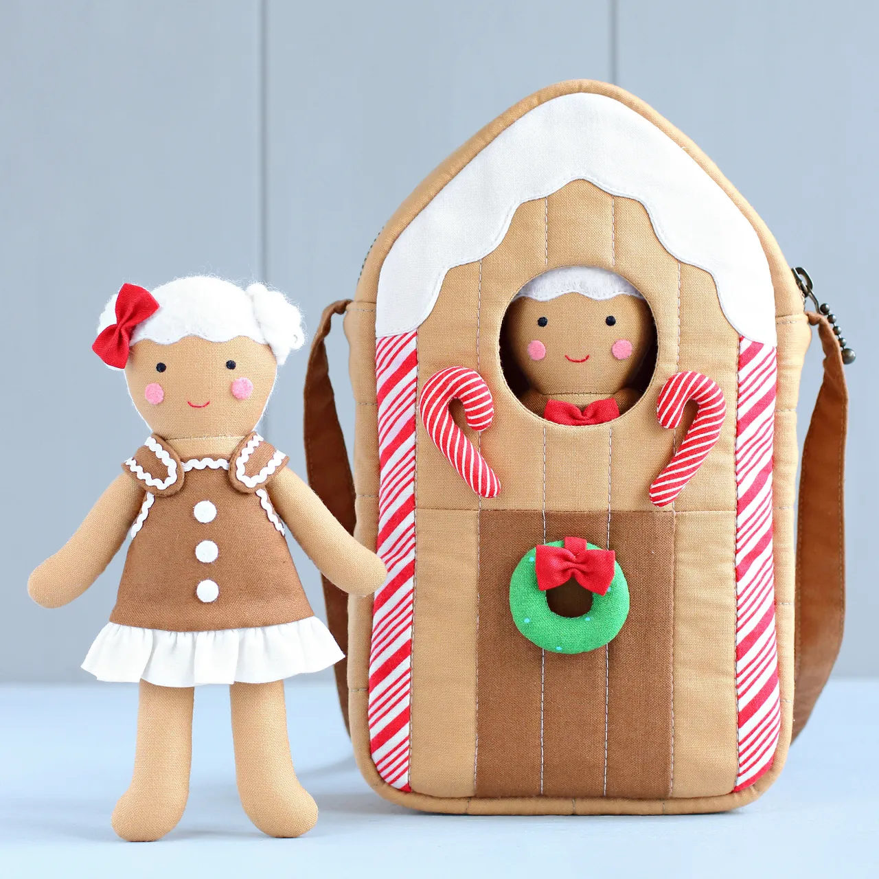 You can never have too many gingerbreads! :) Small, but exceedingly cute sewing project — a gingerbread house, which is actually a bag to carry a gingerbread boy or girl rag doll! Lots of fun to make and a great Christmas gift for a kid! Sew it quickly and easily with my sewing pattern!