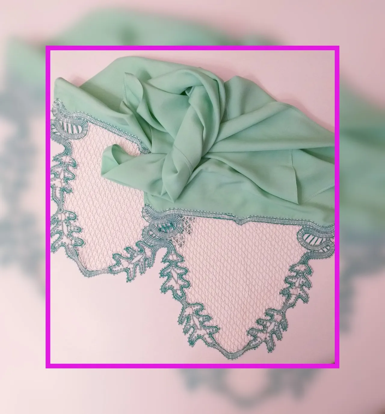 Cotton lace edges woven on bobbins for a green staple scarf. The lace edges are woven using the European lace making technique.