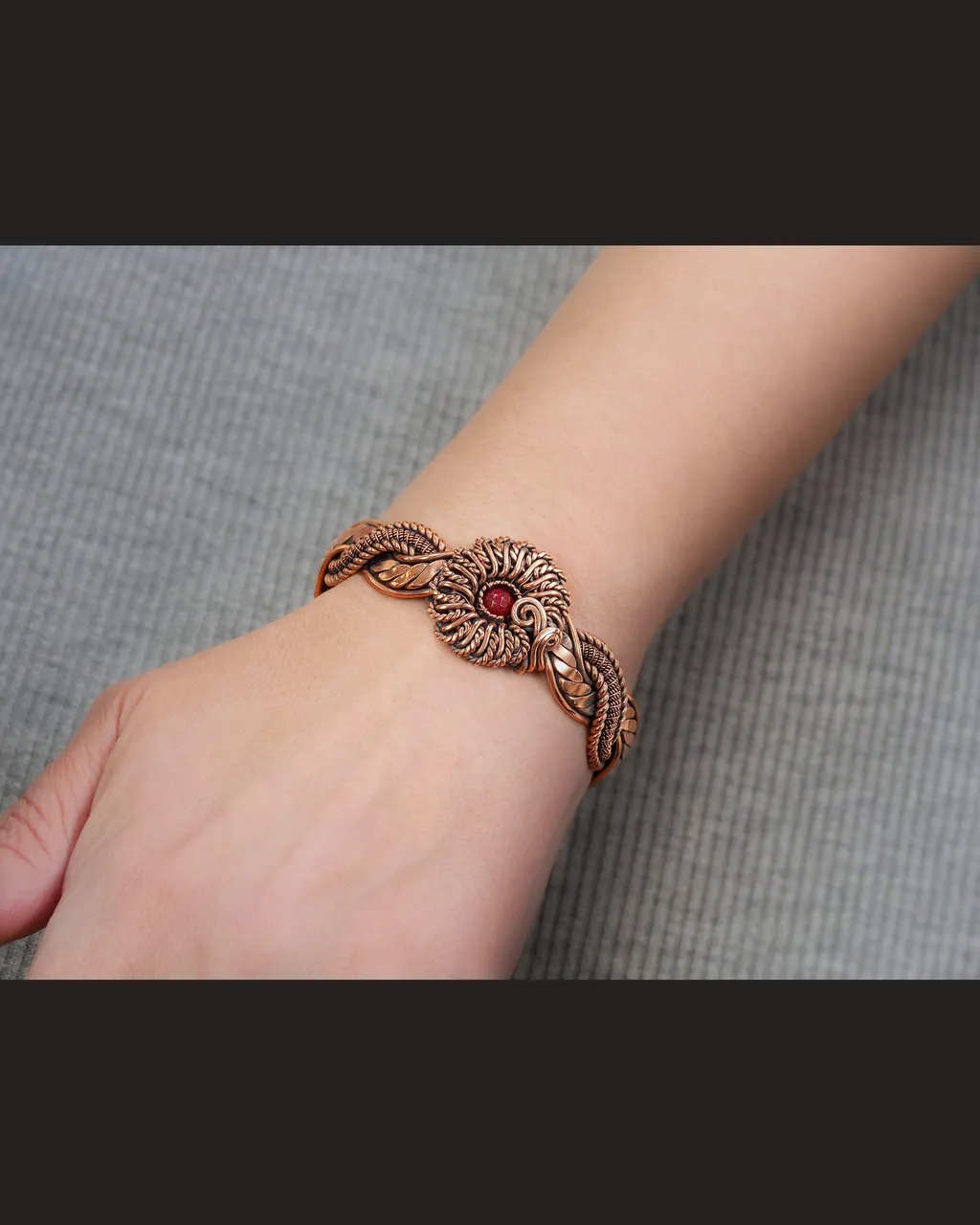 Copper wire wrapped red Agate bracelet for woman, Statement flower jewelry, 7th Anniversary gift for her woman, Unique copper jewelry, Braided Art Nouveau antique style bracelet, Oxidized pure copper, Handmade
❂ The bracelet is made of pure copper wire and natural red agate. The copper is artificially aged with patination, which gives an antique look and makes the details of the bracelet more expressive. After patination, the bracelet was polished to a shine, which gives a beautiful aesthetic appearance to the bracelet. The bracelet is covered with a protective varnish to prevent darkening.
You will receive the exact bracelet you see in the photos.
The bracelet can be combined with any wardrobe and emphasize your uniqueness and style.
❂ Bracelet details:
◀◀ READ IT PLEASE ▶▶ I offer several options for the length of the bracelet. To correctly choose the size of the bracelet, you need to add 1.5 cm (0.6") to the size of your wrist girth. You will get the length of the bracelet that suits you. Choose the desired length of the bracelet from the suggested options.
Bracelet Width: 1 cm