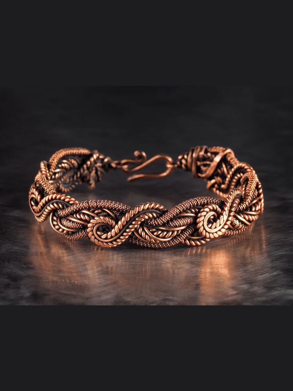 Wire wrapped bracelet, Unique 7th 22nd Anniversary gift idea, Art Nouveau antique style, One of kind braided statement bangle, Handmade oxidized pure copper jewelry, Pain relief, EMF protection

❂ The bracelet is made of pure copper wire. The copper is artificially aged with patination, which gives an antique look and makes the details of the bracelet more expressive. After patination, the bracelet was polished to a shine, which gives a beautiful aesthetic appearance to the bracelet. The bracelet is covered with a protective varnish to prevent darkening.
You will receive the exact bracelet you see in the photos.
The bracelet can be combined with any wardrobe and emphasize your uniqueness and style
Bracelet Width: 1.3 cm