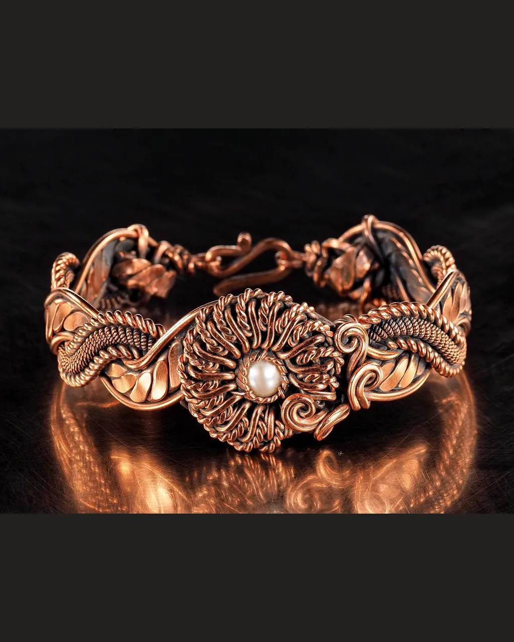 Copper wire wrapped natural Pearl bracelet for woman, Statement flower jewelry, 7th Anniversary gift for her woman, Unique copper jewelry, Braided Art Nouveau antique style bracelet, Oxidized pure copper, Handmade
❂ The bracelet is made of pure copper wire and natural Pearl. The copper is artificially aged with patination, which gives an antique look and makes the details of the bracelet more expressive. After patination, the bracelet was polished to a shine, which gives a beautiful aesthetic appearance to the bracelet. The bracelet is covered with a protective varnish to prevent darkening.
You will receive the exact bracelet you see in the photos.
The bracelet can be combined with any wardrobe and emphasize your uniqueness and style.
Bracelet Width: 2.5 cm