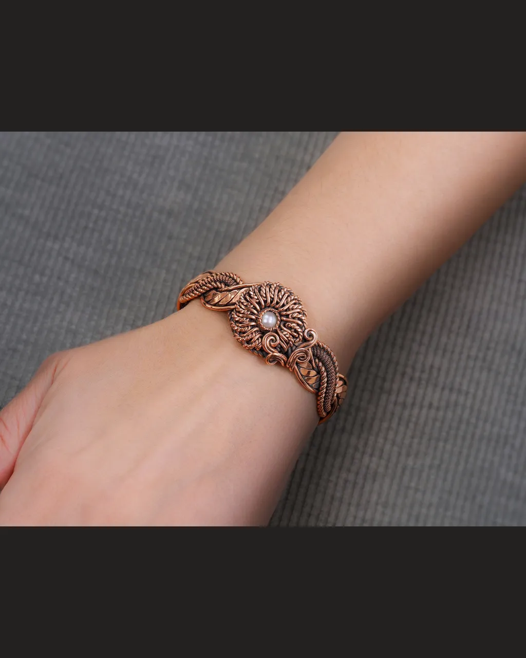 Copper wire wrapped natural Pearl bracelet for woman, Statement flower jewelry, 7th Anniversary gift for her woman, Unique copper jewelry, Braided Art Nouveau antique style bracelet, Oxidized pure copper, Handmade
❂ The bracelet is made of pure copper wire and natural Pearl. The copper is artificially aged with patination, which gives an antique look and makes the details of the bracelet more expressive. After patination, the bracelet was polished to a shine, which gives a beautiful aesthetic appearance to the bracelet. The bracelet is covered with a protective varnish to prevent darkening.
You will receive the exact bracelet you see in the photos.
The bracelet can be combined with any wardrobe and emphasize your uniqueness and style.
Bracelet Width: 2.5 cm