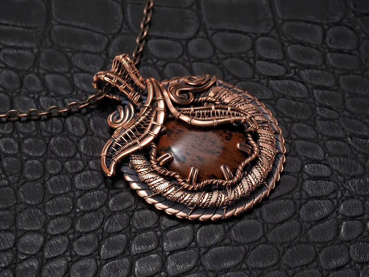 This unique was pendant handcrafted by weaving pure copper wire and natural red obsidian. Copper was artificially aged to create an antique look and to highlight the details of the wire work. Polished to a shine and varnished to prevent darkening.
Each piece is handcrafted by me from start to finish. Each piece is designed by me and is always unique. Each work in a single copy. Completely handmade!
This pendant can be a wonderful addition to your image, as well as a memorable gift!
You will get exactly the jewelry that you see in the photo.
Each piece is one of a kind and crafted with love!

Item details:
Height -5.8 cm
Width - 4.7 cm

If you have questions - just ask.
I wish you a happy shopping time and a good mood!