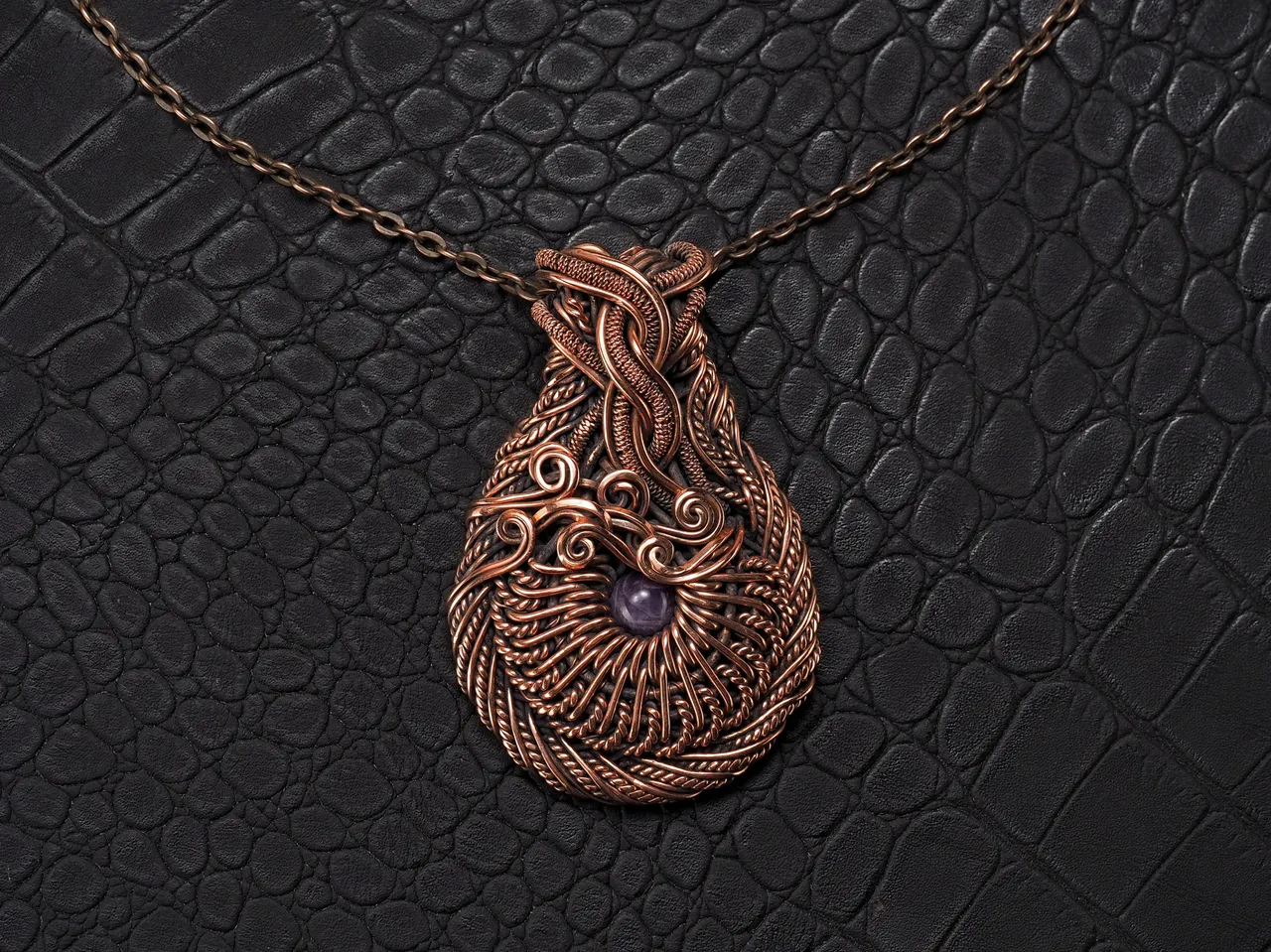 Wire wrapped copper pendant this natural faceted amethyst Unique gemstone necklace 7th 22nd Wedding Anniversary gift idea Unique artisan pure copper wire wrapped jewelry Antique style Handmade jewellery Healing gemstone necklace Wearable art by WireWrapAr
This stunning pendant is truly a work of art. Handcrafted with pure copper wire and natural amethyst gemstone, this necklace is a unique and beautiful piece. Each wire is meticulously wrapped to create an antique style design that is truly one of a kind. Perfect for a 7th or 22nd wedding anniversary gift, this necklace is a unique and thoughtful way to show your love. The healing properties of the amethyst make this necklace not only stunning but also meaningful. This wearable art by WireWrapArt is the perfect addition to any jewelry collection.
Material: copper, amethyst.
Height - 6.7 cm
Width - 4.4 cm