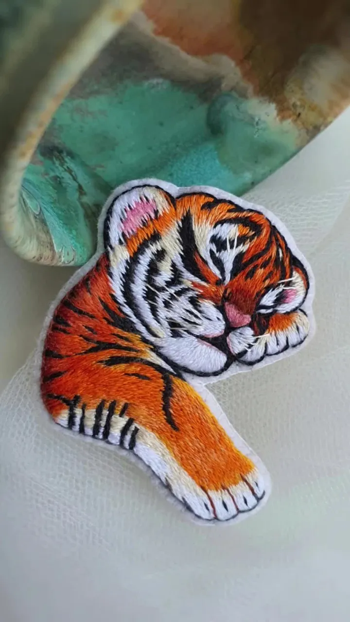 Watch magic unfold! 🌟 From blank fabric to a tiny wearable masterpiece.