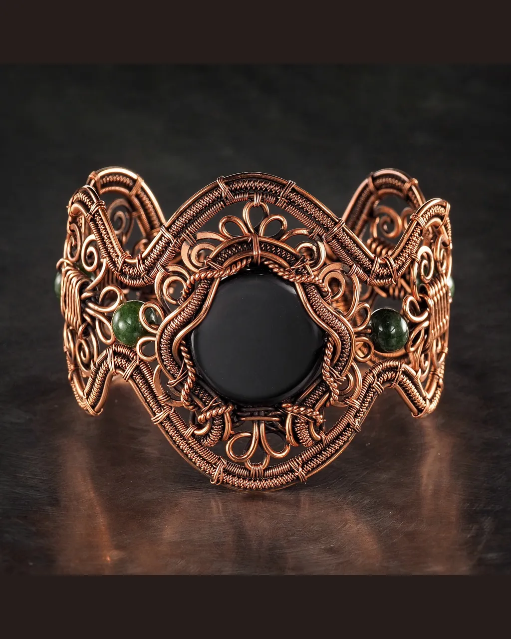 Wide wire wrapped bracelet for woman, Copper, Black Onyx, Jade, Statement jewelry, 7th Anniversary gift for her woman, Unique copper jewelry, Braided Art Nouveau antique style bracelet, Oxidized pure copper, Handmade
❂ The bracelet is made of pure copper wire natural black onyx and jade . The copper is artificially aged with patination, which gives an antique look and makes the details of the bracelet more expressive. After patination, the bracelet was polished to a shine, which gives a beautiful aesthetic appearance to the bracelet. The bracelet is covered with a protective varnish to prevent darkening.
You will receive the exact bracelet you see in the photos.
The bracelet can be combined with any wardrobe and emphasize your uniqueness and style
Bracelet Width:5.8 cm