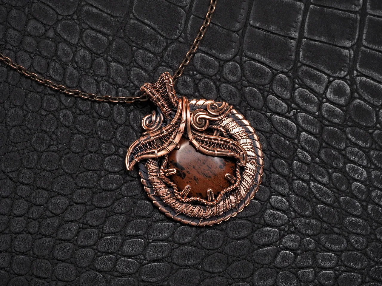 This unique was pendant handcrafted by weaving pure copper wire and natural red obsidian. Copper was artificially aged to create an antique look and to highlight the details of the wire work. Polished to a shine and varnished to prevent darkening.
Each piece is handcrafted by me from start to finish. Each piece is designed by me and is always unique. Each work in a single copy. Completely handmade!
This pendant can be a wonderful addition to your image, as well as a memorable gift!
You will get exactly the jewelry that you see in the photo.
Each piece is one of a kind and crafted with love!

Item details:
Height -5.8 cm
Width - 4.7 cm

If you have questions - just ask.
I wish you a happy shopping time and a good mood!