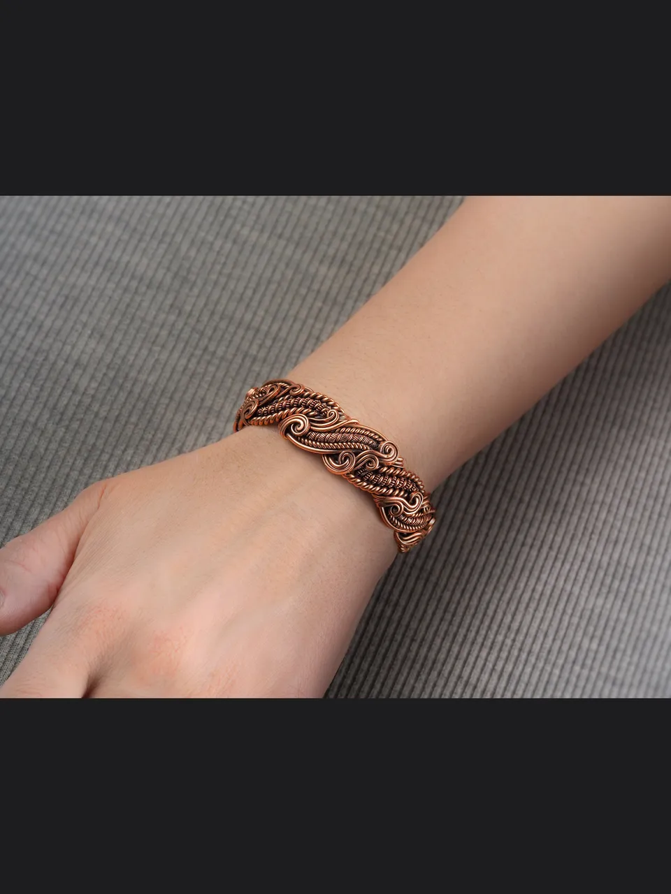 Wire wrapped copper bracelet by WIREWRAPART
❂ This beautiful pure copper bracelet by WIREWRAPART jewelry makes the perfect 7th or 22nd Anniversary gift.
❂ This unique copper wire wrapped bracelet is a timeless addition to any jewelry collection and is sure to be treasured by your loved one.
❂ Crafted with high-quality copper wire, this bracelet is durable and long-lasting. This one, like any bracelet from my store, is one of a kind.
❂ This handcrafted copper wire bracelet features an antique style design, carefully crafted with intricate copper wire wrapping techniques.
❂ The warm tones of copper will beautifully complement any skin tone, making this bracelet a versatile and timeless accessory.
❂ Perfect for both casual and formal occasions, this wearable art piece will make a statement wherever you go.
❂ The copper bracelet is a functional solution for pain relief. This bracelet is a must-have for anyone seeking a natural approach to managing pain.
❂ The antimagnetic properties of this copper bracelet are designed to block harmful EMF waves, reducing exposure to potentially harmful radiation.