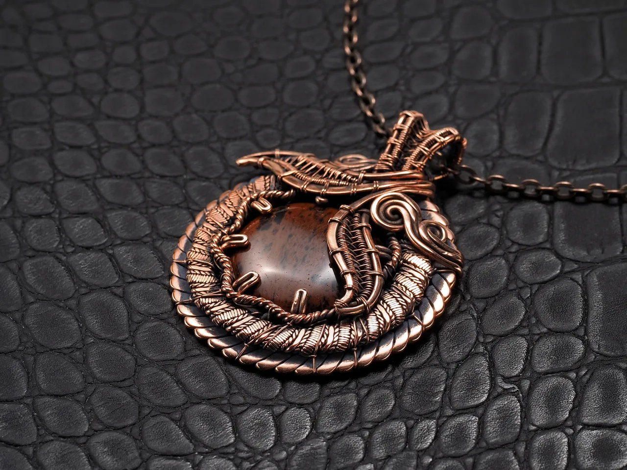 This unique was pendant handcrafted by weaving pure copper wire and natural red obsidian. Copper was artificially aged to create an antique look and to highlight the details of the wire work. Polished to a shine and varnished to prevent darkening.
Each piece is handcrafted by me from start to finish. Each piece is designed by me and is always unique. Each work in a single copy. Completely handmade!
This pendant can be a wonderful addition to your image, as well as a memorable gift!
You will get exactly the jewelry that you see in the photo.
Each piece is one of a kind and crafted with love!

Item details:
Height -5.8 cm
Width - 4.7 cm

If you have questions - just ask.
I wish you a happy shopping time and a good mood!
