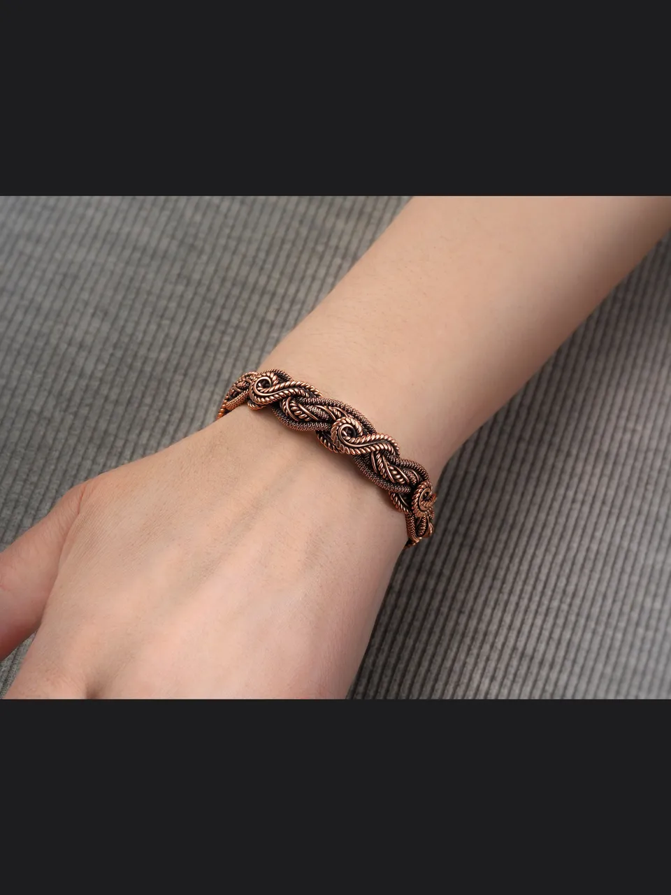 Wire wrapped bracelet, Unique 7th 22nd Anniversary gift idea, Art Nouveau antique style, One of kind braided statement bangle, Handmade oxidized pure copper jewelry, Pain relief, EMF protection

❂ The bracelet is made of pure copper wire. The copper is artificially aged with patination, which gives an antique look and makes the details of the bracelet more expressive. After patination, the bracelet was polished to a shine, which gives a beautiful aesthetic appearance to the bracelet. The bracelet is covered with a protective varnish to prevent darkening.
You will receive the exact bracelet you see in the photos.
The bracelet can be combined with any wardrobe and emphasize your uniqueness and style
Bracelet Width: 1.3 cm