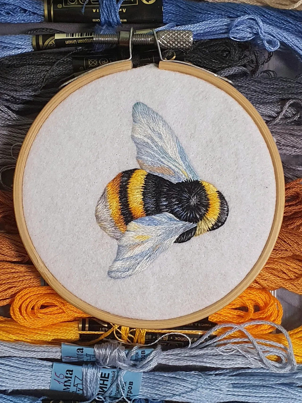 I am drawing. My paints are threads, and my brush is a needle in my hands. Please like if you enjoy watching the embroidery process.