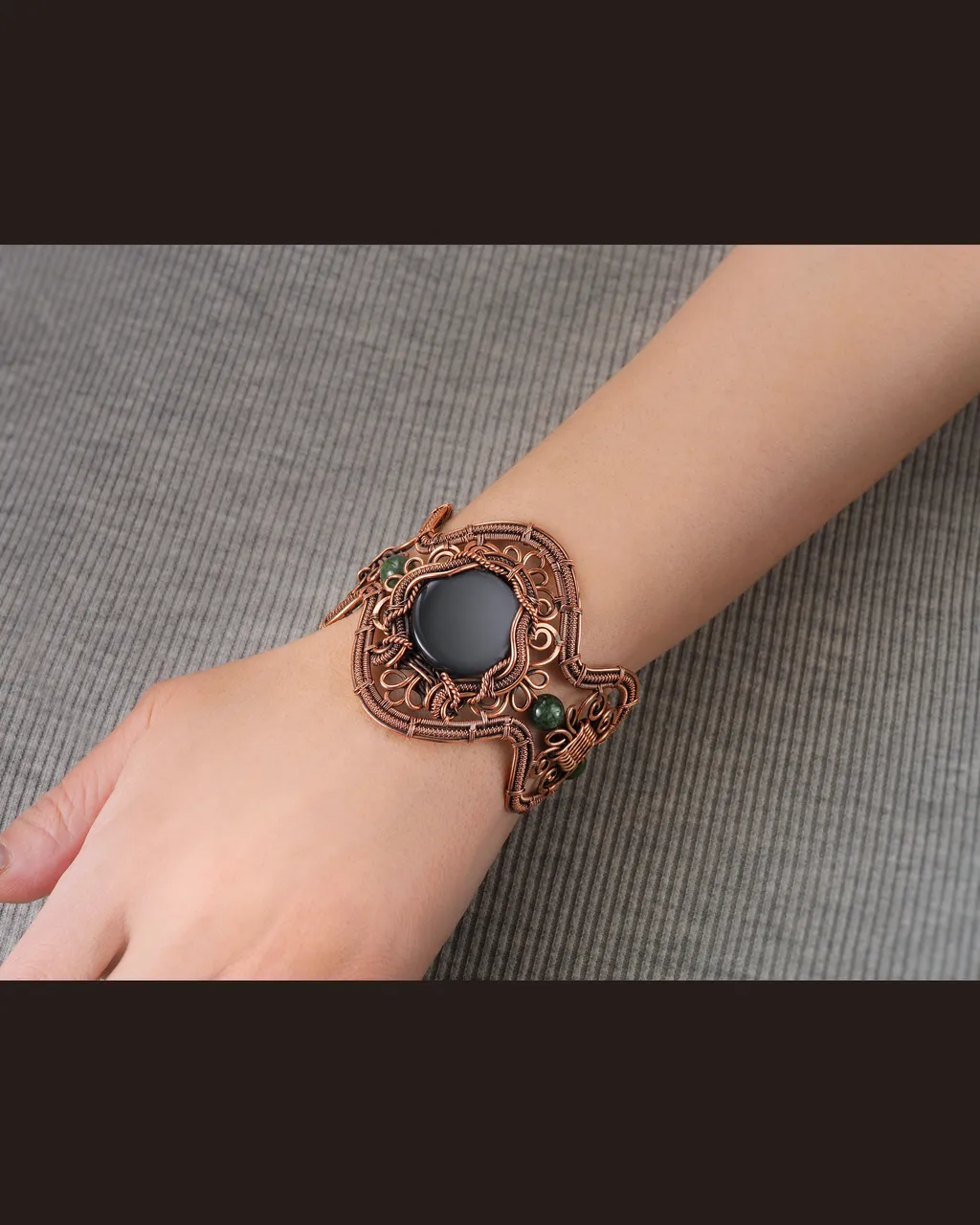 Wide wire wrapped bracelet for woman, Copper, Black Onyx, Jade, Statement jewelry, 7th Anniversary gift for her woman, Unique copper jewelry, Braided Art Nouveau antique style bracelet, Oxidized pure copper, Handmade
❂ The bracelet is made of pure copper wire natural black onyx and jade . The copper is artificially aged with patination, which gives an antique look and makes the details of the bracelet more expressive. After patination, the bracelet was polished to a shine, which gives a beautiful aesthetic appearance to the bracelet. The bracelet is covered with a protective varnish to prevent darkening.
You will receive the exact bracelet you see in the photos.
The bracelet can be combined with any wardrobe and emphasize your uniqueness and style
Bracelet Width:5.8 cm