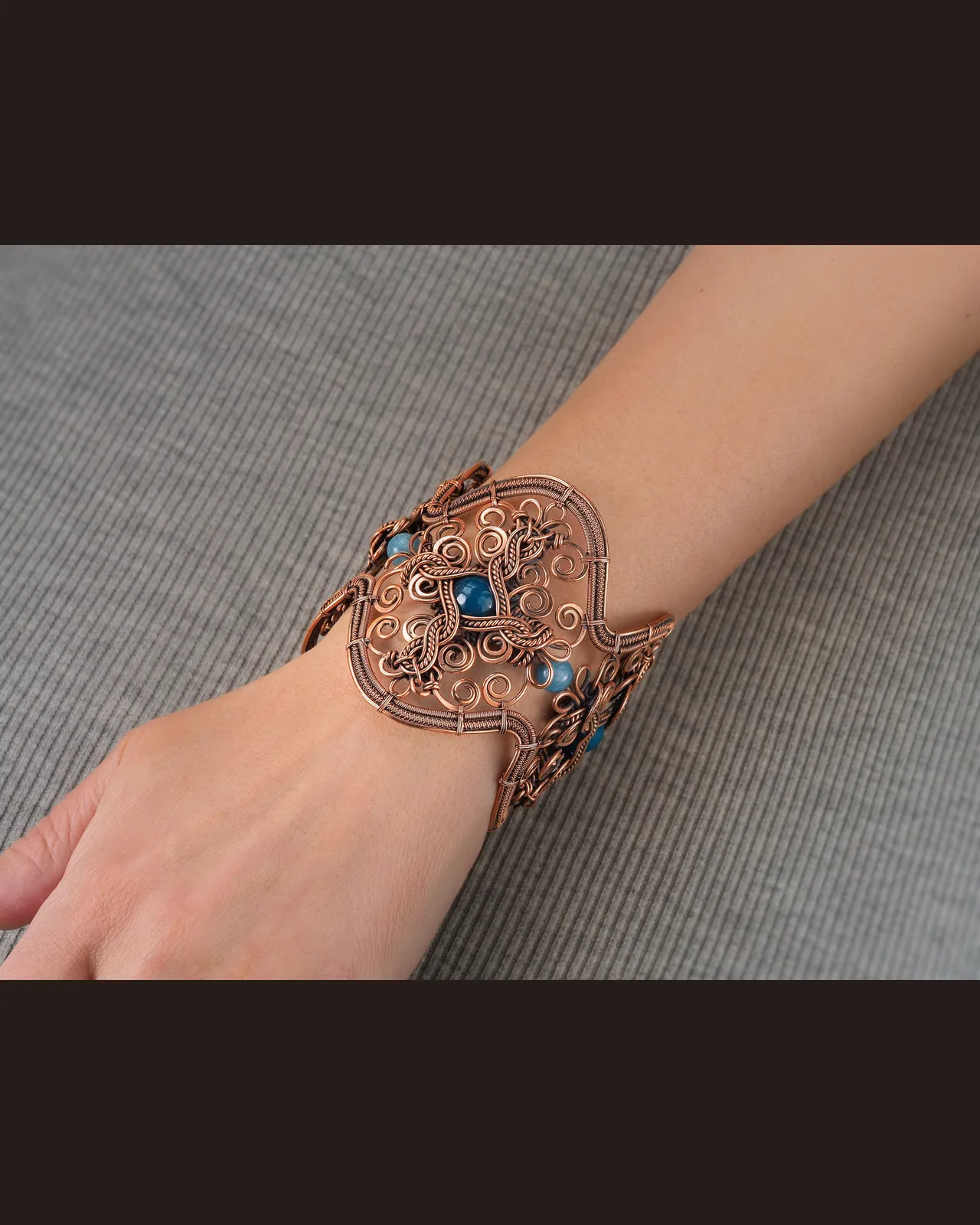 Very wide copper wire wrapped bracelet with blue Agate for woman , Statement jewelry, 7th Anniversary gift for her woman, Unique copper jewelry, Braided Art Nouveau antique style bracelet, Oxidized pure copper, Handmade
❂ The bracelet is made of pure copper wire and blue agate . The copper is artificially aged with patination, which gives an antique look and makes the details of the bracelet more expressive. After patination, the bracelet was polished to a shine, which gives a beautiful aesthetic appearance to the bracelet. The bracelet is covered with a protective varnish to prevent darkening.
You will receive the exact bracelet you see in the photos.
The bracelet can be combined with any wardrobe and emphasize your uniqueness and style.
❂ Bracelet details:
◀◀ READ IT PLEASE ▶▶ I offer several options for the length of the bracelet. To correctly choose the size of the bracelet, you need to add 1.5 cm (0.6") to the size of your wrist girth. You will get the length of the bracelet that suits you. Choose the desired length of the bracelet from the suggested options.
Bracelet Width:6.8 cm