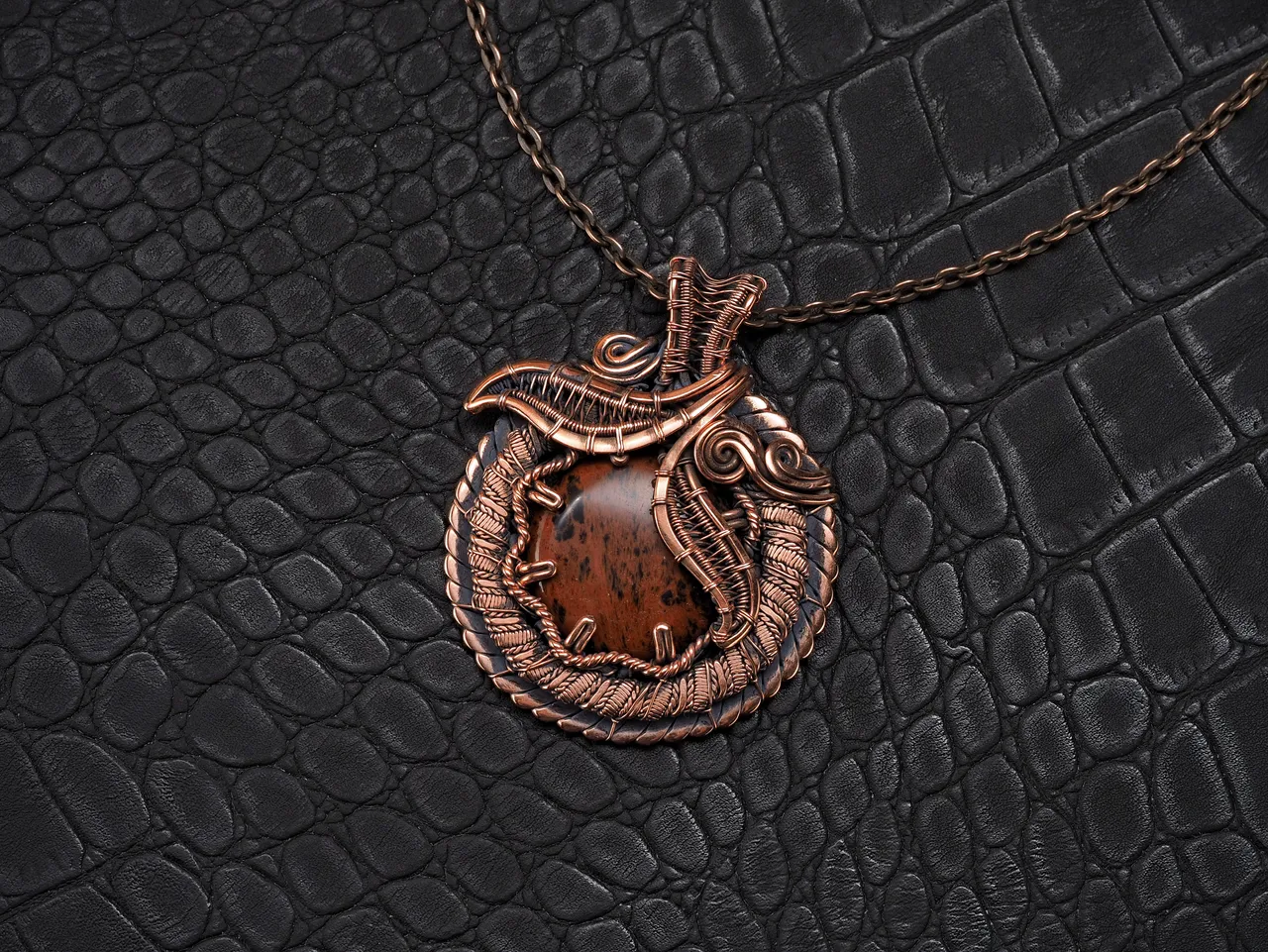 This unique was pendant handcrafted by weaving pure copper wire and natural red obsidian. Copper was artificially aged to create an antique look and to highlight the details of the wire work. Polished to a shine and varnished to prevent darkening.
Each piece is handcrafted by me from start to finish. Each piece is designed by me and is always unique. Each work in a single copy. Completely handmade!
This pendant can be a wonderful addition to your image, as well as a memorable gift!
You will get exactly the jewelry that you see in the photo.
Each piece is one of a kind and crafted with love!

Item details:
Height -5.8 cm
Width - 4.7 cm

If you have questions - just ask.
I wish you a happy shopping time and a good mood!