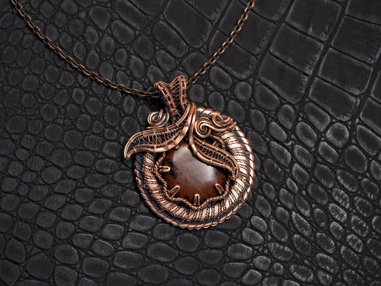 This unique was pendant handcrafted by weaving pure copper wire and natural red obsidian. Copper was artificially aged to create an antique look and to highlight the details of the wire work. Polished to a shine and varnished to prevent darkening.
Each piece is handcrafted by me from start to finish. Each piece is designed by me and is always unique. Each work in a single copy. Completely handmade!
This pendant can be a wonderful addition to your image, as well as a memorable gift!
You will get exactly the jewelry that you see in the photo.
Each piece is one of a kind and crafted with love!

Item details:
Height -5.8 cm
Width - 4.7 cm

If you have questions - just ask.
I wish you a happy shopping time and a good mood!