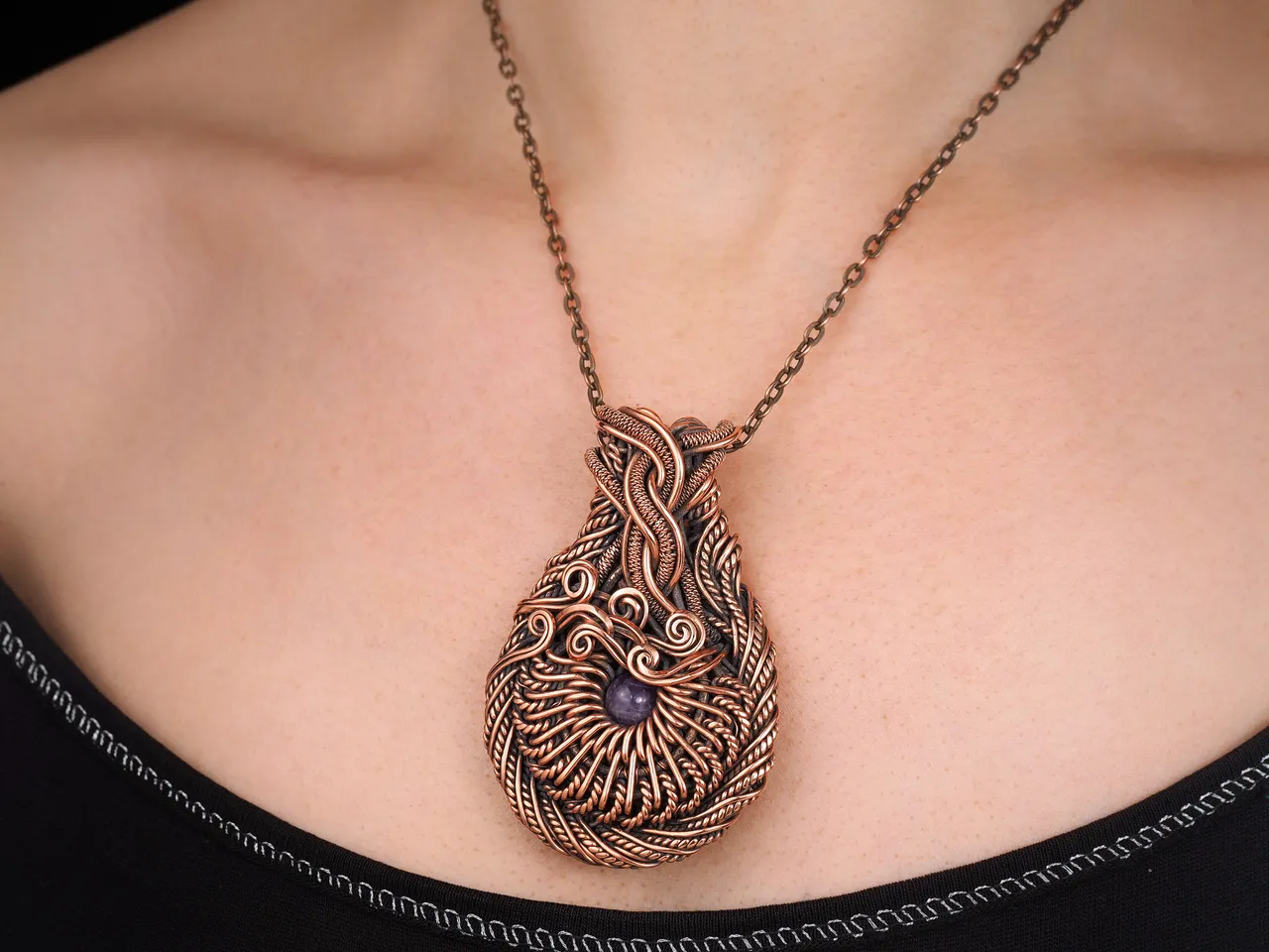 Wire wrapped copper pendant this natural faceted amethyst Unique gemstone necklace 7th 22nd Wedding Anniversary gift idea Unique artisan pure copper wire wrapped jewelry Antique style Handmade jewellery Healing gemstone necklace Wearable art by WireWrapAr
This stunning pendant is truly a work of art. Handcrafted with pure copper wire and natural amethyst gemstone, this necklace is a unique and beautiful piece. Each wire is meticulously wrapped to create an antique style design that is truly one of a kind. Perfect for a 7th or 22nd wedding anniversary gift, this necklace is a unique and thoughtful way to show your love. The healing properties of the amethyst make this necklace not only stunning but also meaningful. This wearable art by WireWrapArt is the perfect addition to any jewelry collection.
Material: copper, amethyst.
Height - 6.7 cm
Width - 4.4 cm