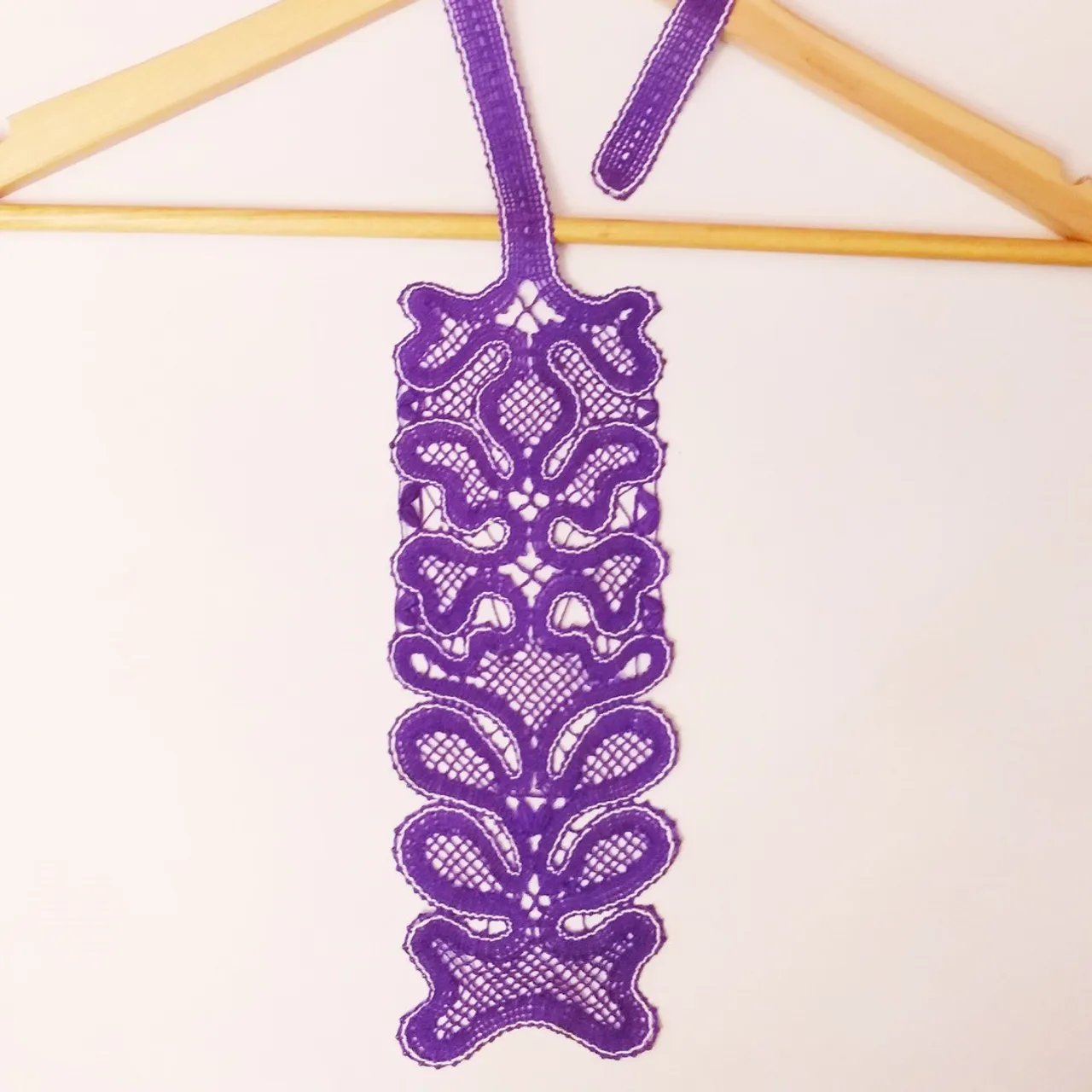Making a lace purple bobbin tie.