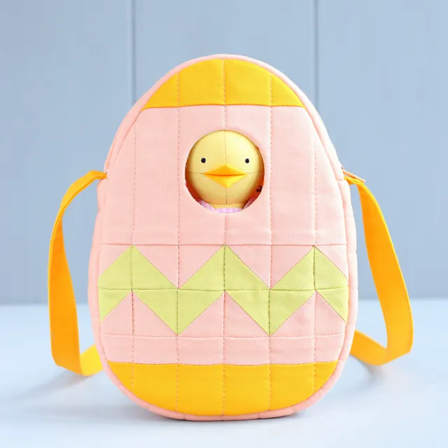 Fresh from the sewing machine! Another small quilted bag — an Easter egg for carrying the Easter chick. I really love to add windows to my bags and pouches. It literally takes just a couple of minutes, but makes the bag so much more fun! The sewing pattern is already available in my store!