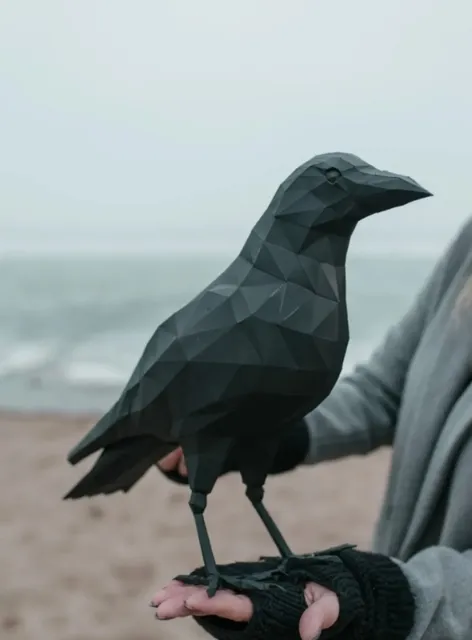 A magnificent raven made of paper.