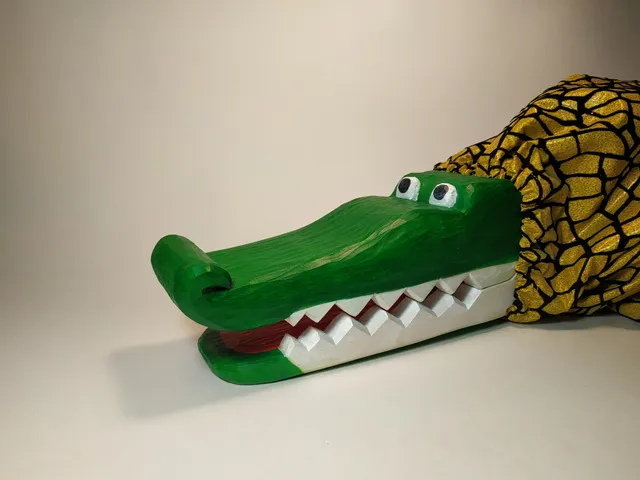 Wooden toy, crocodile with opening mouth.

￼

￼