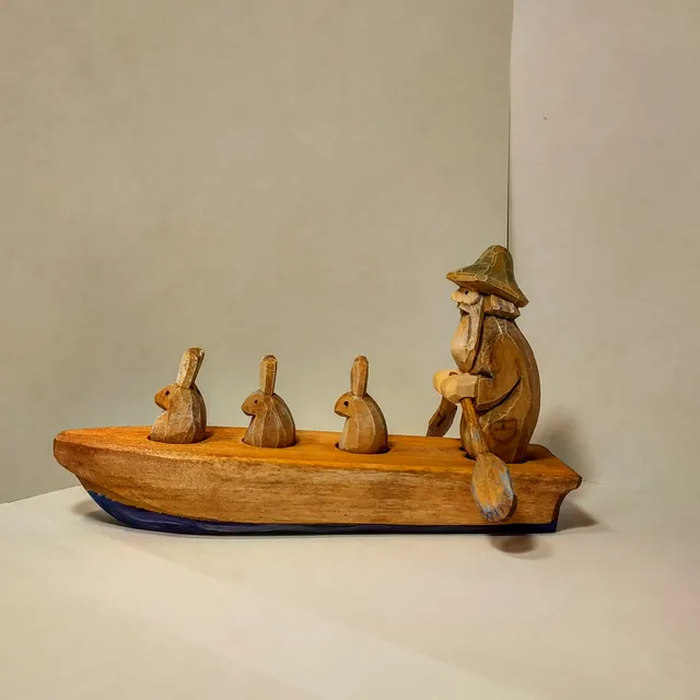 Wooden toys. grandfather Mazay and hares.