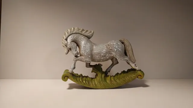 Wooden miniature rocking horse.