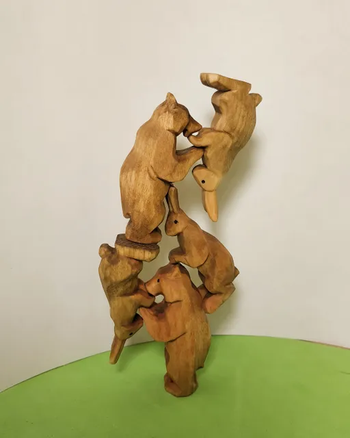 Wooden toys, bear cubs and bunnies, acrobats.