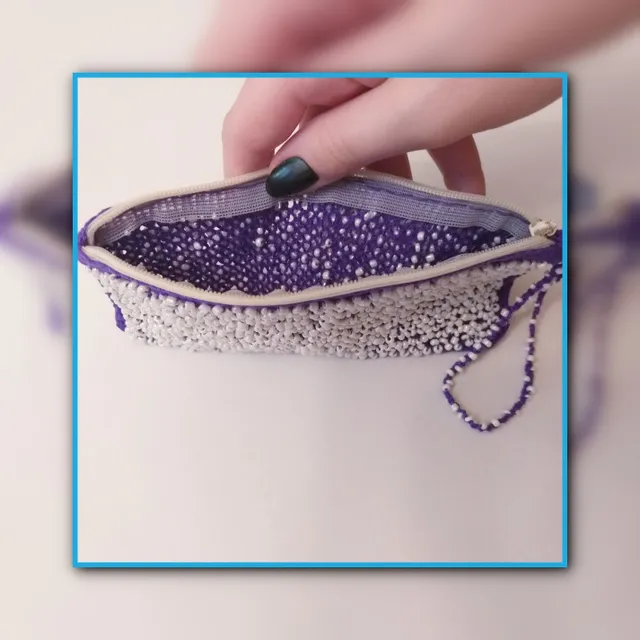 Purple lace bag woven on bobbins with beads. Weaving process.