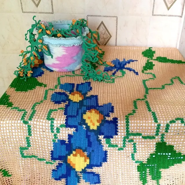 Filet style crochet tablecloth.