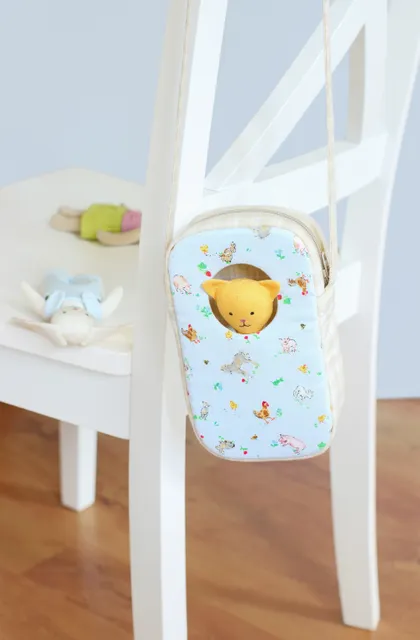 It's so much fun to take your mini stuffed animal or rag doll along for a walk or for a trip!
Sew this cute bag with window to carry a little softie. Your little one will love it! Their doll won't be bored inside this bag, it can look out the window! The sewing pattern is easy to follow and beginner friendly, with lots of sewing tips and tricks.