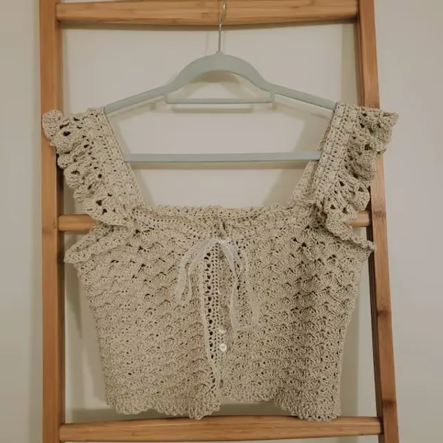 Gorgeous pattern which was simple to make and understand. I made the "XL" size which I felt was around a UK 12 by adding additional shell to the width and 4 more rows for the bust area. The ribbon detailing is so pretty and fits really well. The yarn I used was Drops Muskat (single strand) and a size 5 / 4.5 hook.
May 16, 2023
Kakay Pang