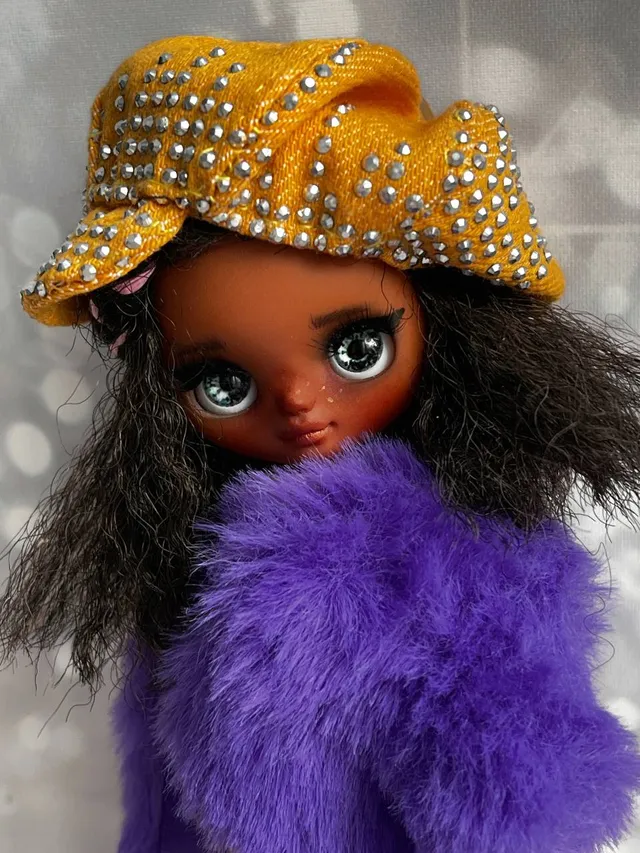 Petite Blythe with dark skin. Adorable miniature doll on an articulated body.