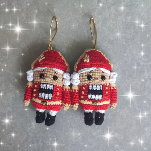 Handmade Christmas Nutcracker pendant toy, red color, crocheted, decorated with beads and embroidery