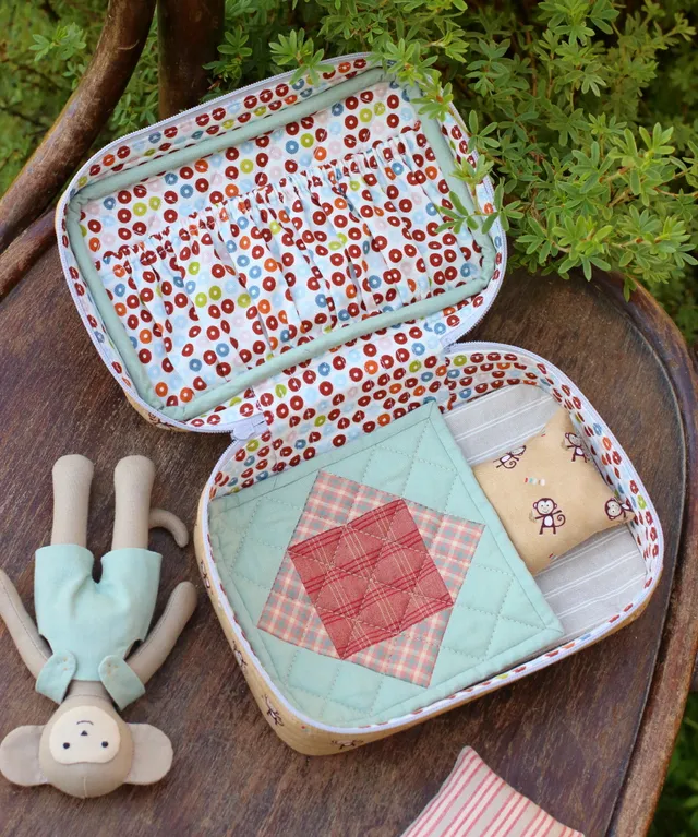 This zipper pouch with bedding and handle on the lid is perfect for carrying a mini rag doll or stuffed animal made with my sewing pattern or other small toys of similar size. Make this travel case yourself and your little one will take their little softies along for a walk or for a trip! Easy to follow and beginner friendly instructions will guide you through the sewing process from beginning to end.