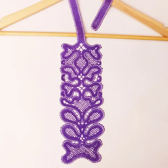 Making a lace purple bobbin tie.