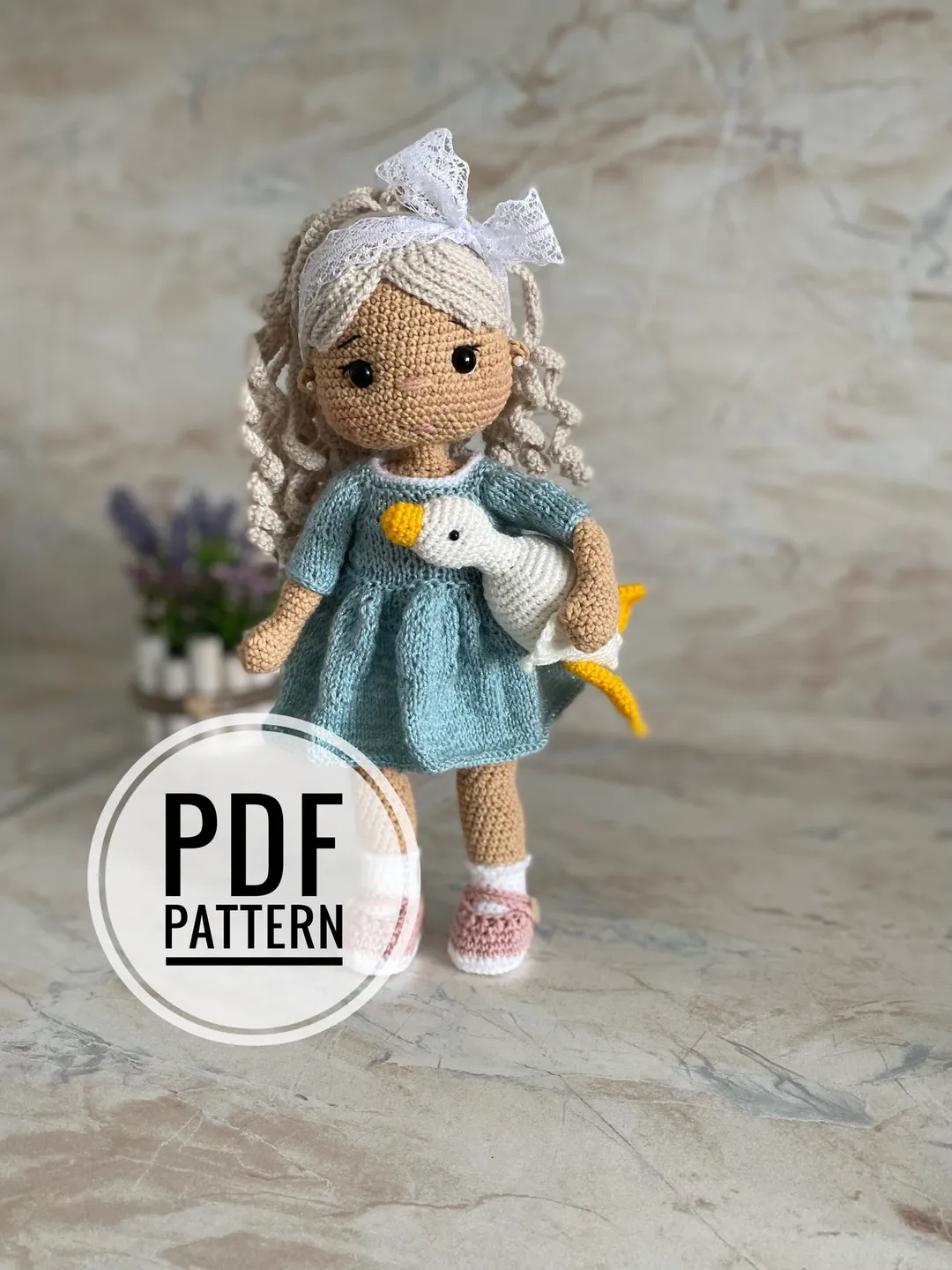 Doll with a goose crochet pattern