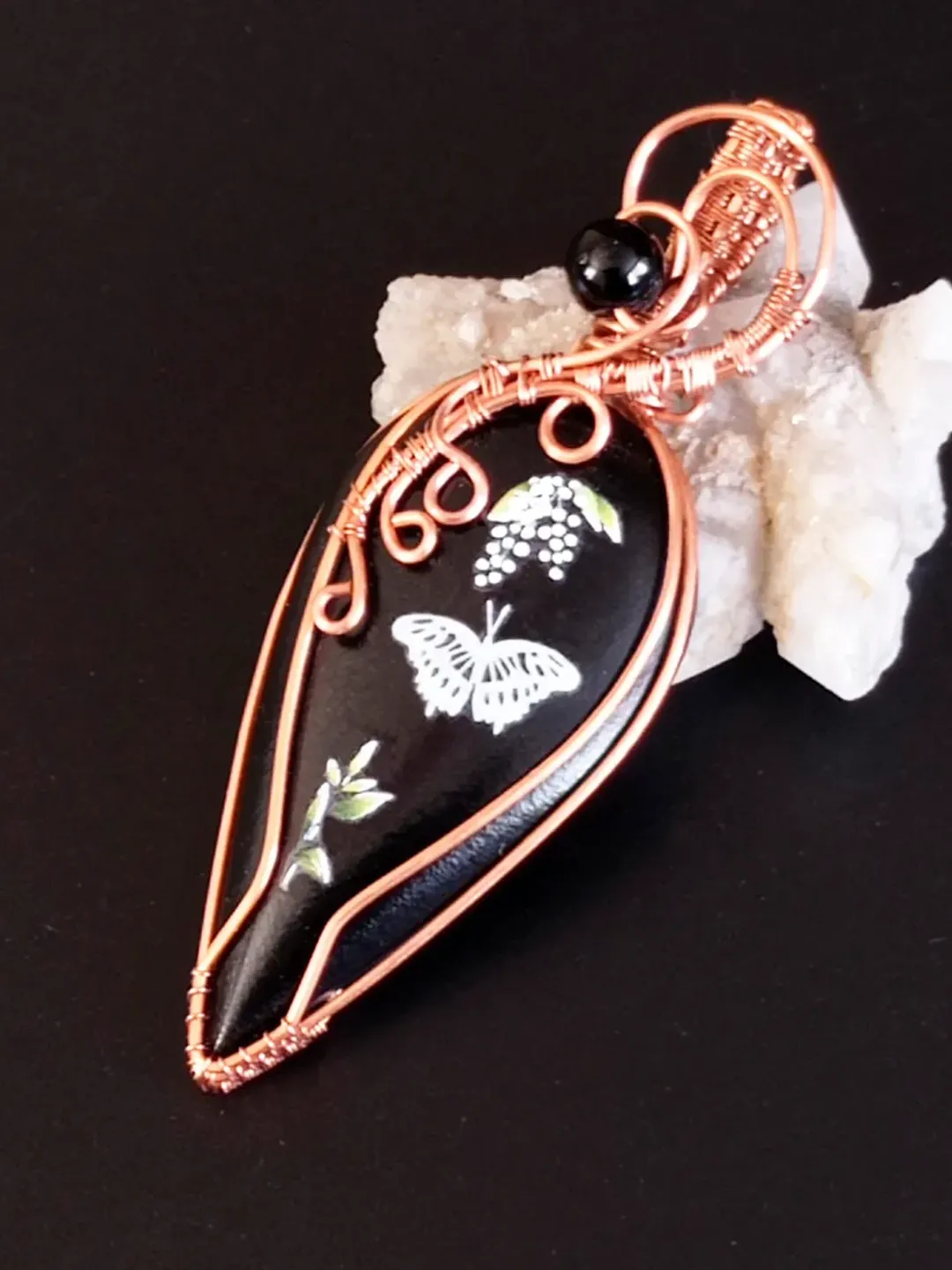 Black Necklace with a luminous butterfly.  Luminous pendant as a gift. Jewelry of black stone on the neck