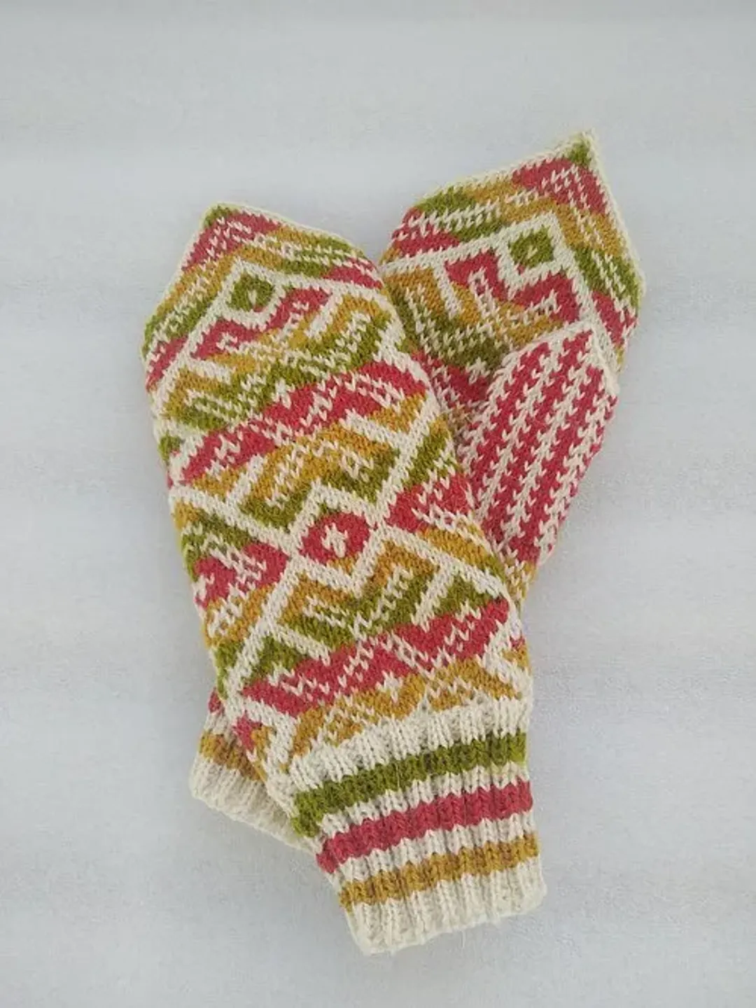 Women's hand-knitted wool mittens are very warm with a pattern